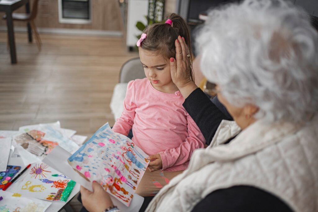 Grandmother admires child's artwork on a cozy afternoon